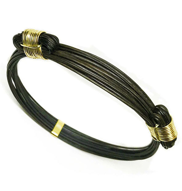 pulsera-2-nudos-corredizos-en-pelo-bufalo-con-oro-18-kilates